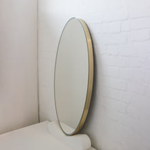 NEW Ovalis™ Oval shaped Front Illuminated Modern Large Mirror with a Brushed Brass Frame