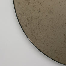 Orbis™ Antiqued Bronze Tinted Round Elegant Mirror with a Black Frame