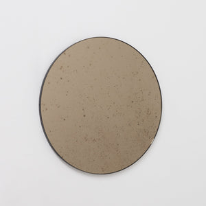 Orbis™ Antiqued Bronze Tinted Round Elegant Mirror with a Black Frame