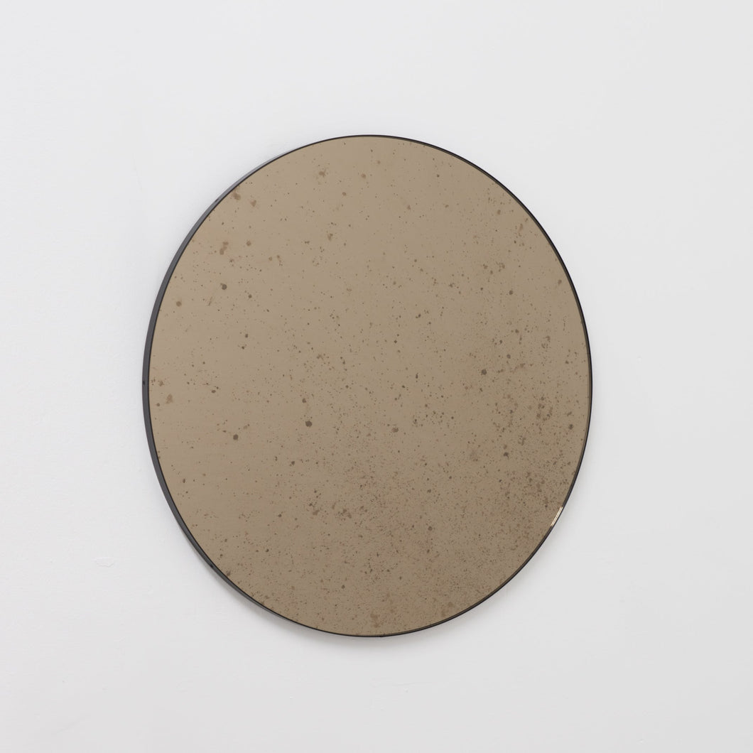 Orbis™ Antiqued Bronze Tinted Round Elegant Mirror with a Black Frame