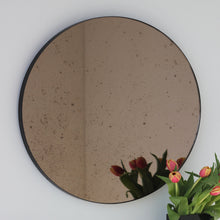 In Stock Orbis™ Antiqued Bronze Tinted Round Elegant Mirror with a Black Frame