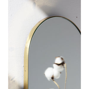 Capsula™ Capsule shaped Modern Mirror with an Elegant Brass Frame