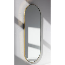 Capsula™ Capsule shaped Modern Mirror with an Elegant Brass Frame