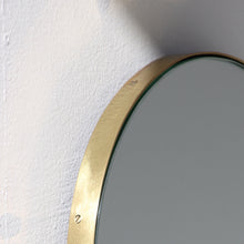 Capsula™ Capsule shaped Modern Mirror with an Elegant Brass Frame